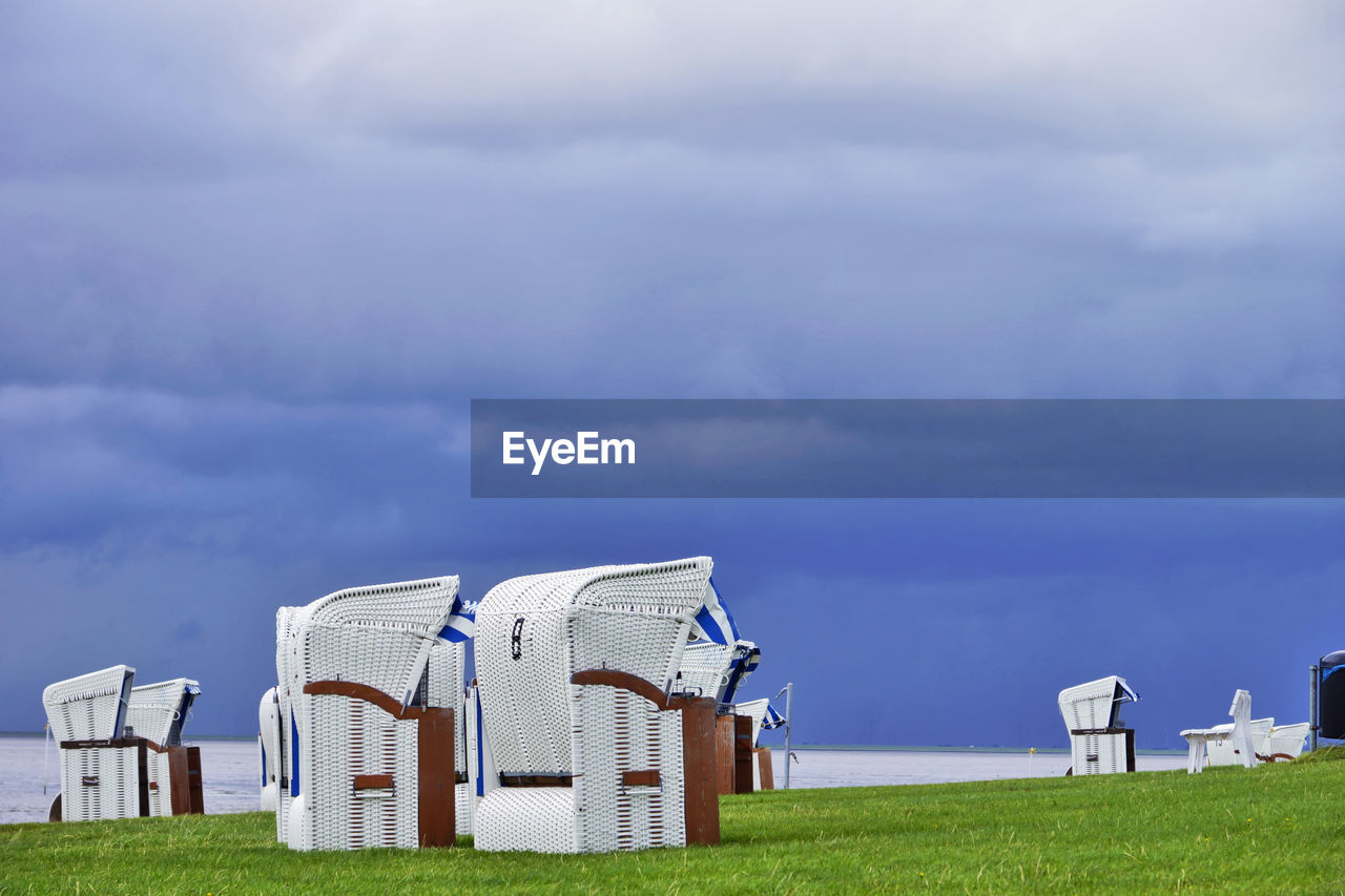 Built structure on field against sky