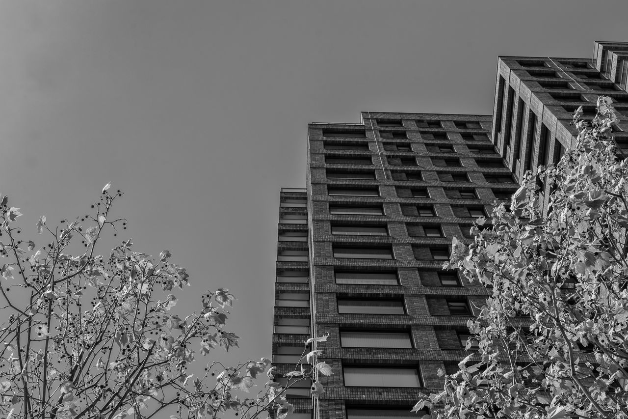 Low angle view of buildings against clear sky