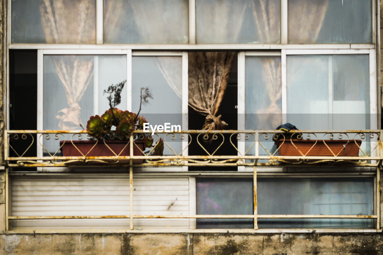 Broken glass window of building