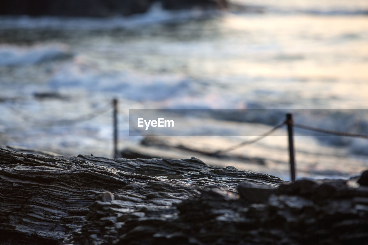 Close-up of rock formations at sea shore