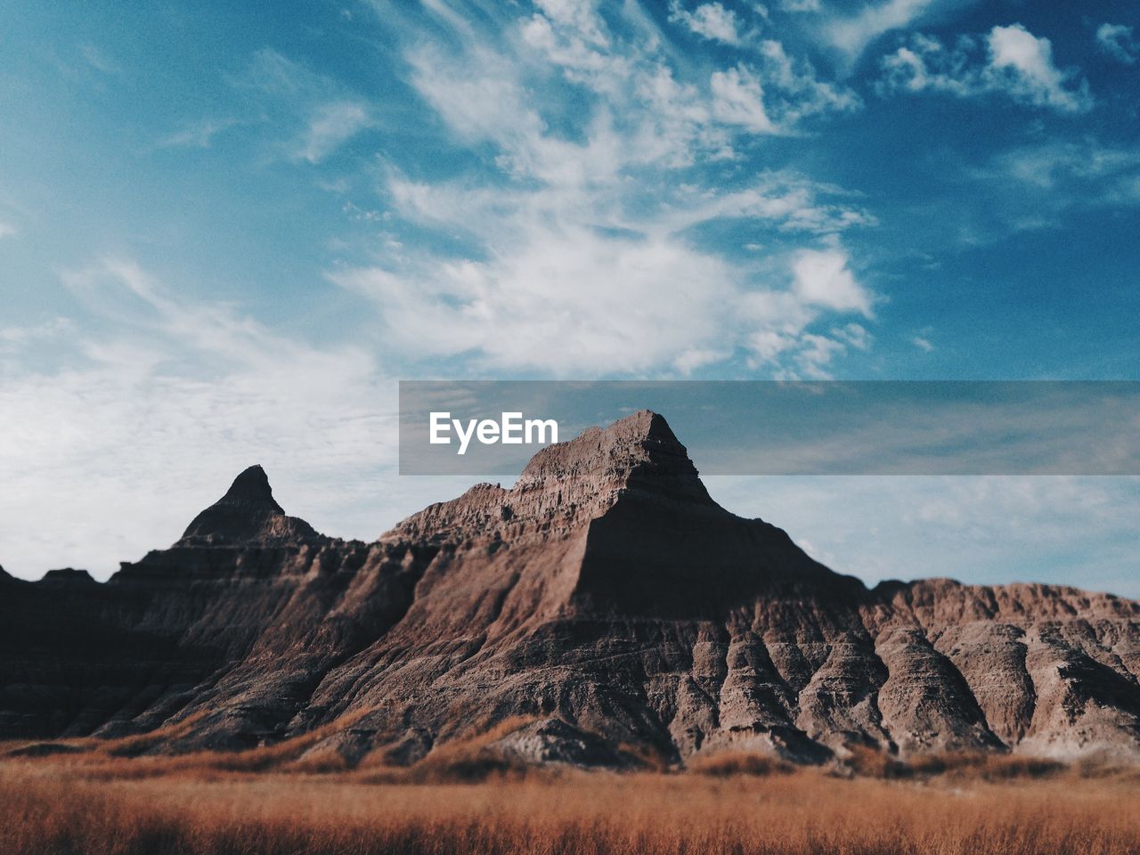 Scenic view of rocky mountains against sky