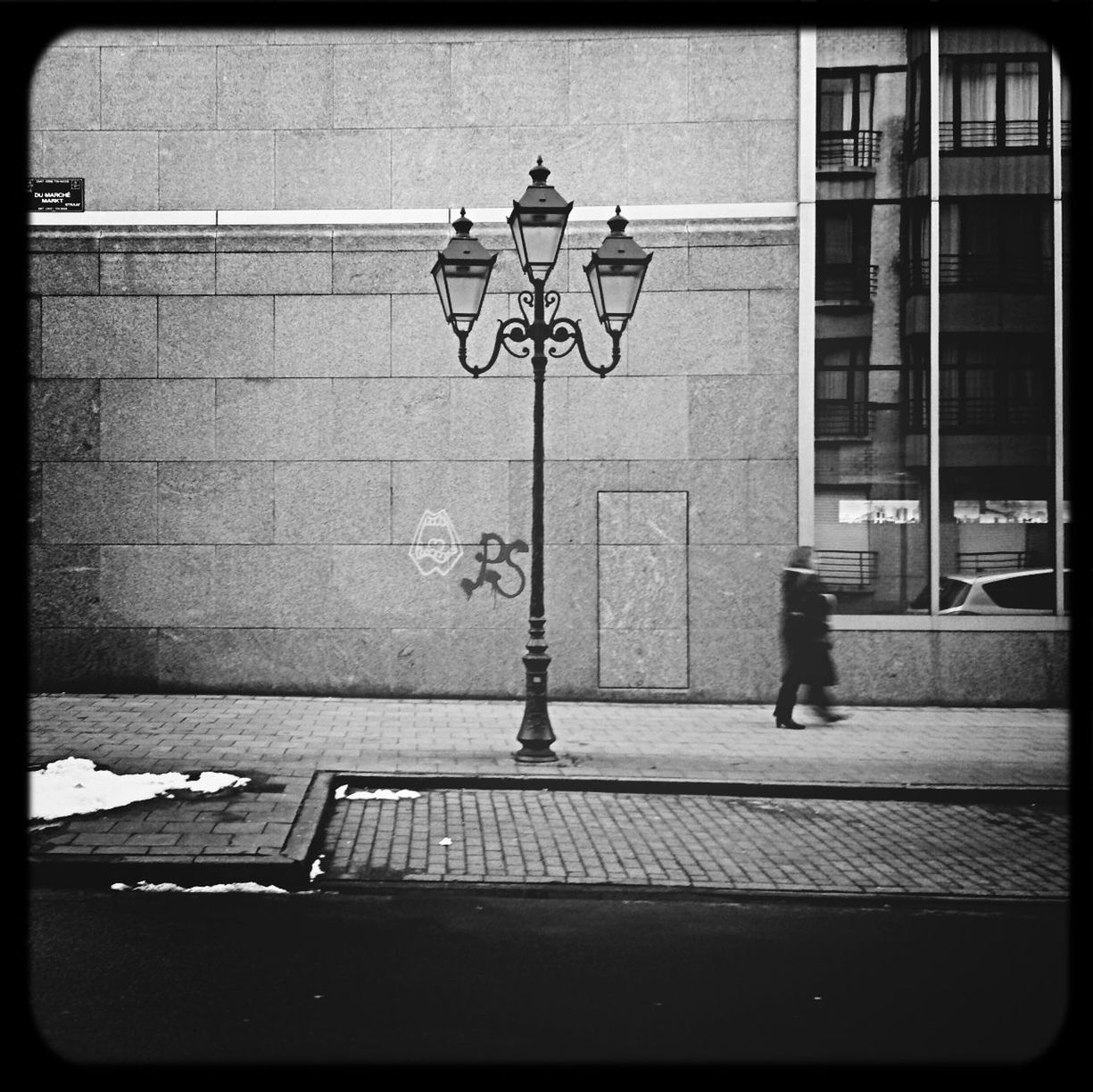 Old-fashioned street light on sidewalk