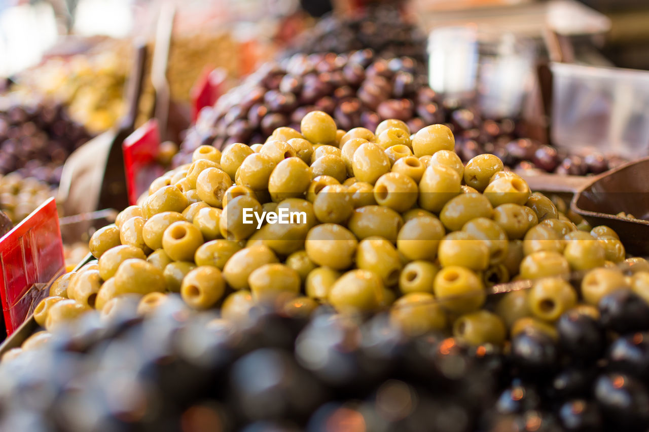 Close-up of olives for sale at market stall
