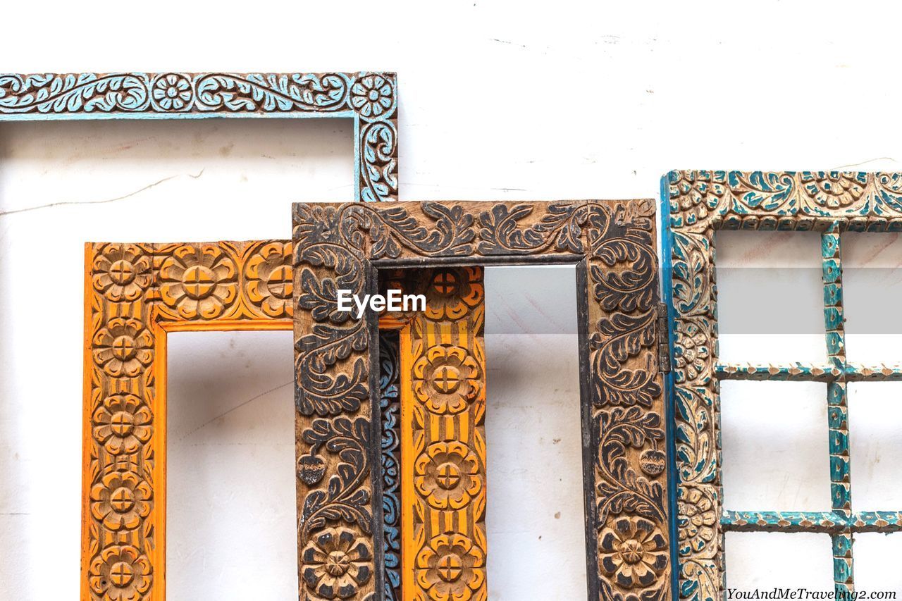 Close-up of picture frames against wall