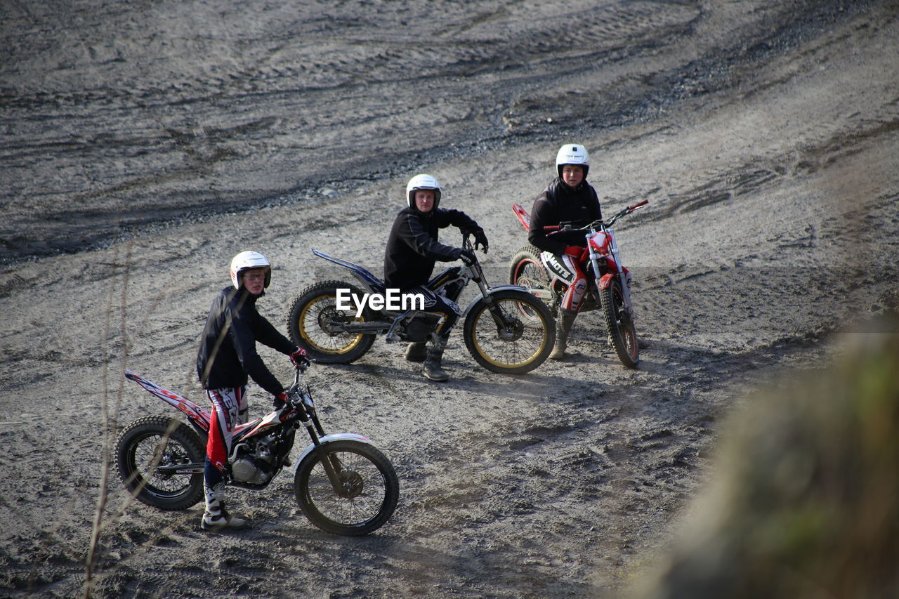 BICYCLES RIDING MOTORCYCLE