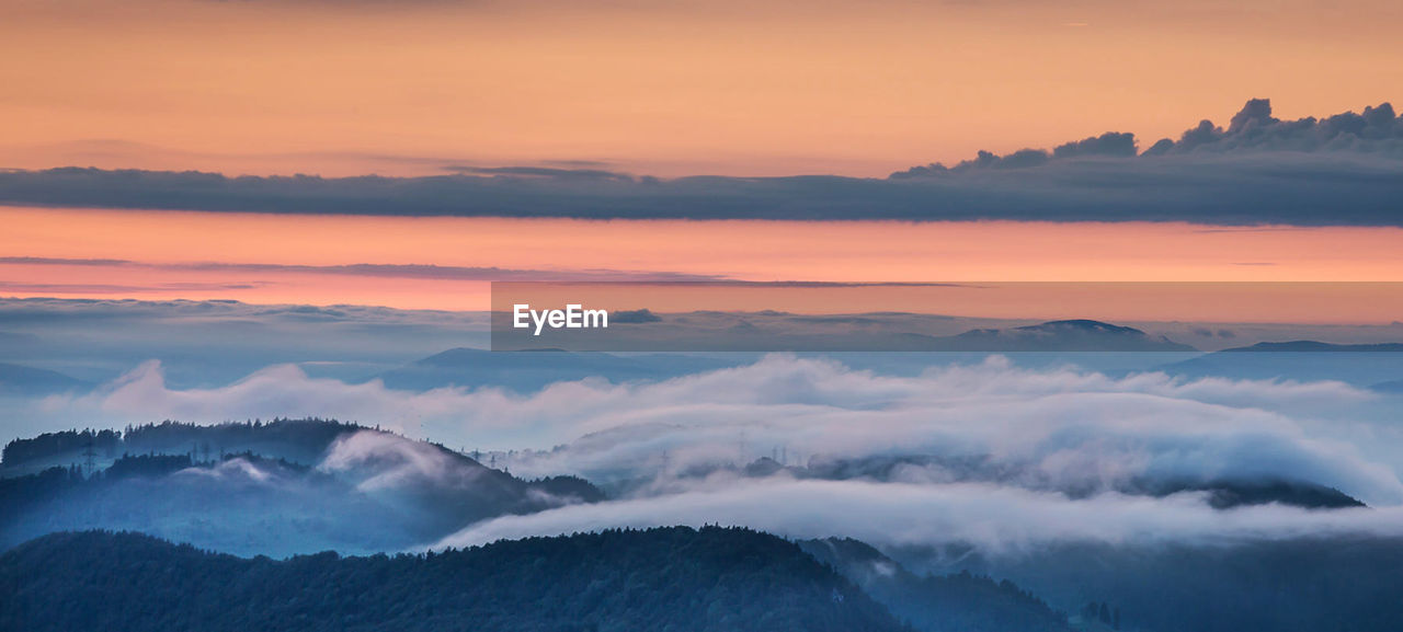 Scenic view of mountains against sky during sunset