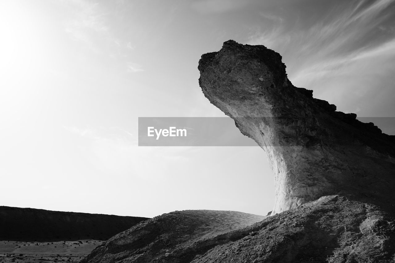 LOW ANGLE VIEW OF CLIFF AGAINST SKY