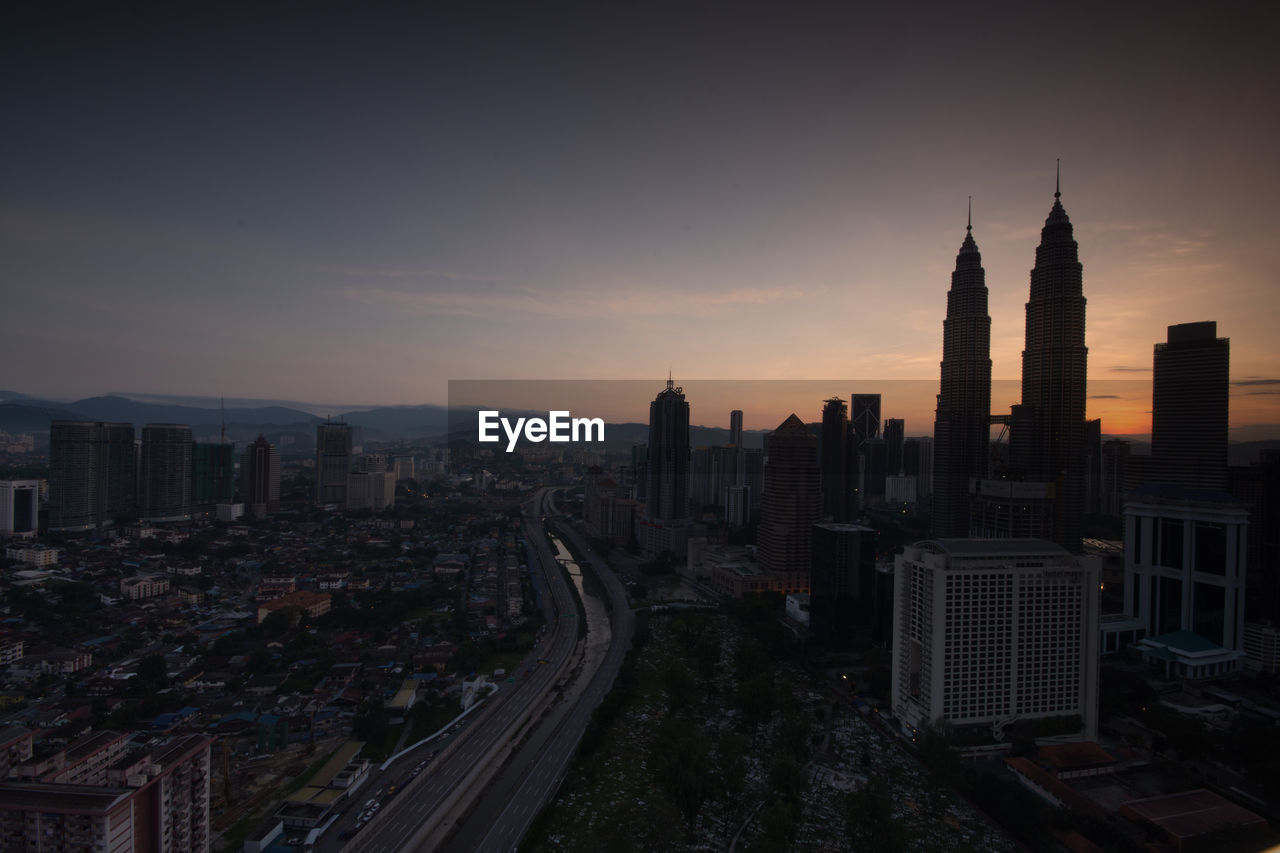 High angle view of city at sunset