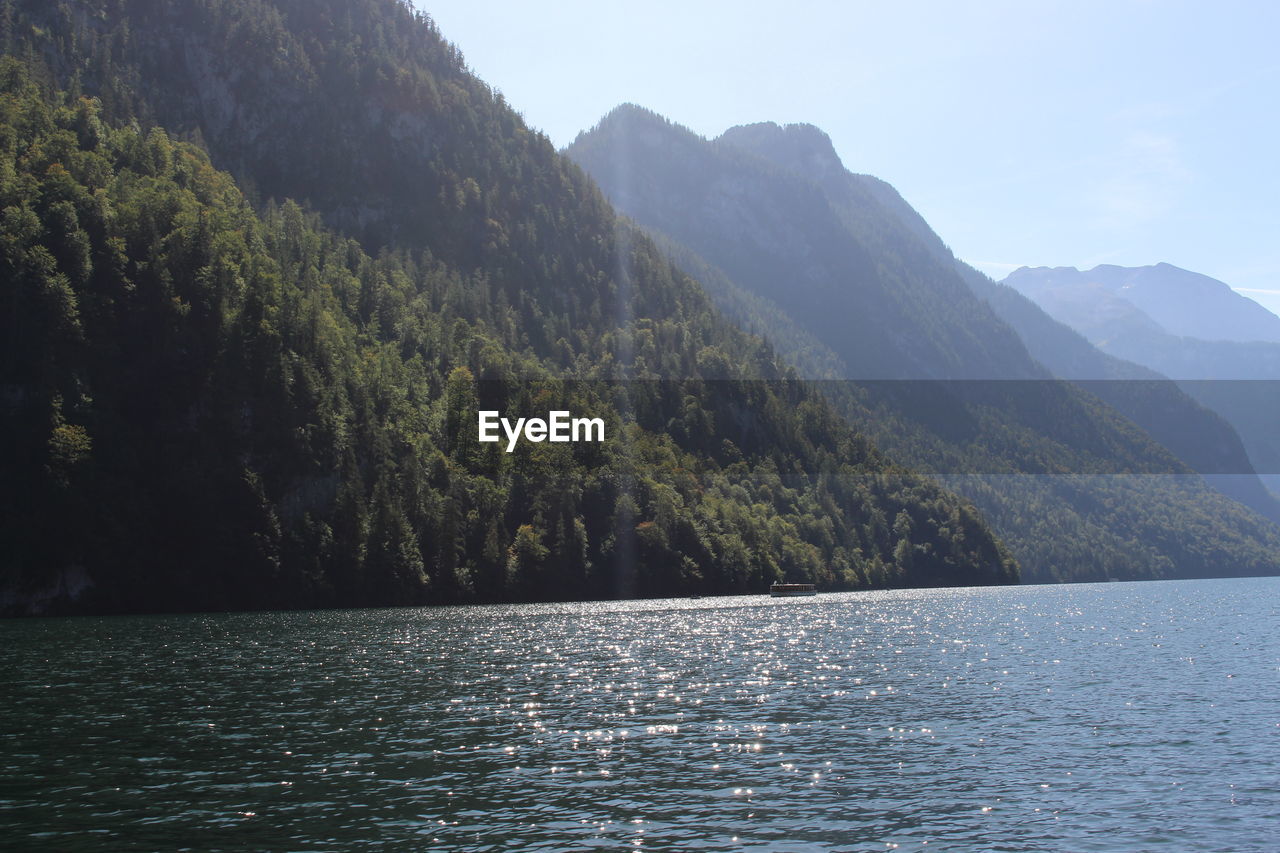 SCENIC VIEW OF LAKE AGAINST MOUNTAIN