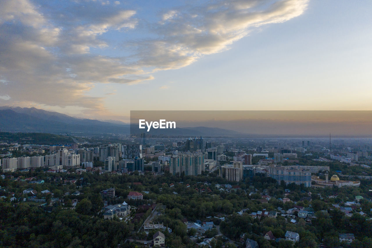 High angle view of buildings against sky during sunset