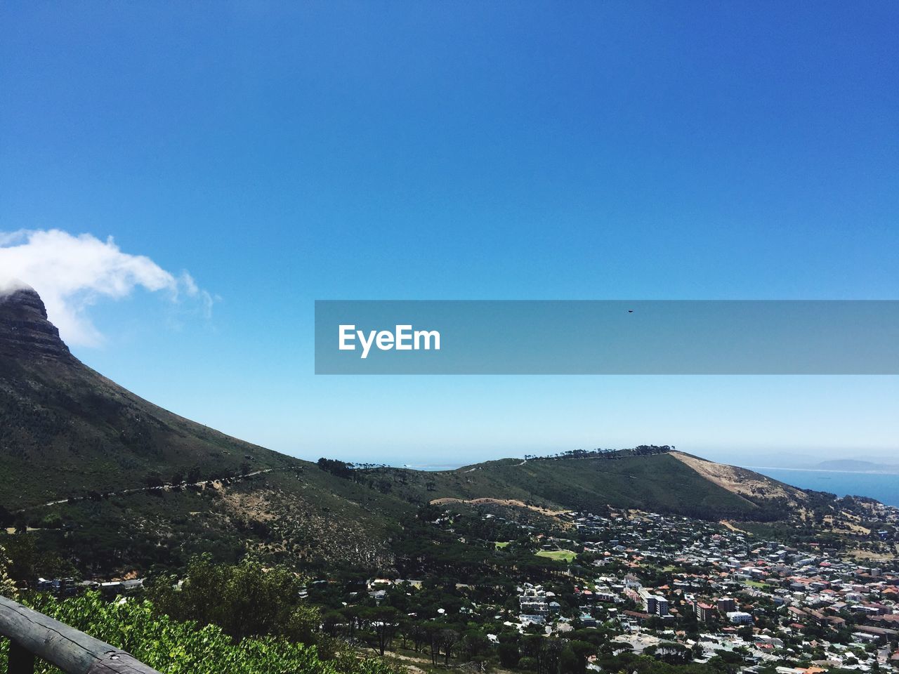 Scenic view of green mountains against clear blue sky on sunny day