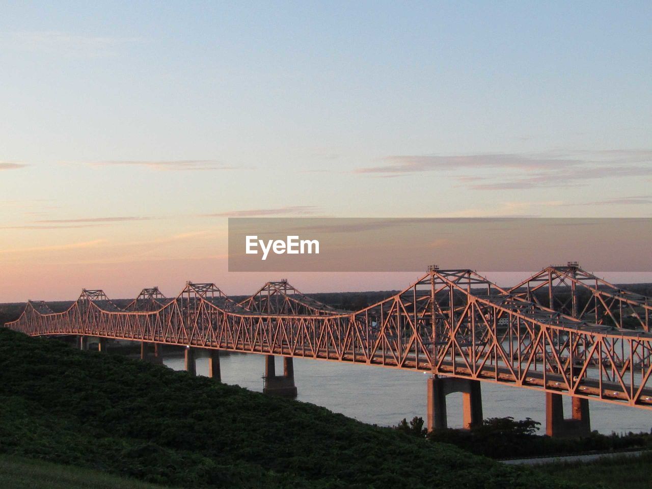 Mississippi bridge against sky during sunset