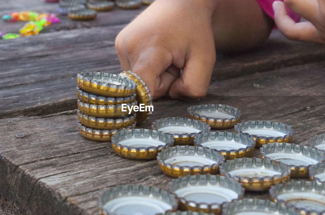 CLOSE-UP OF HAND ON TABLE