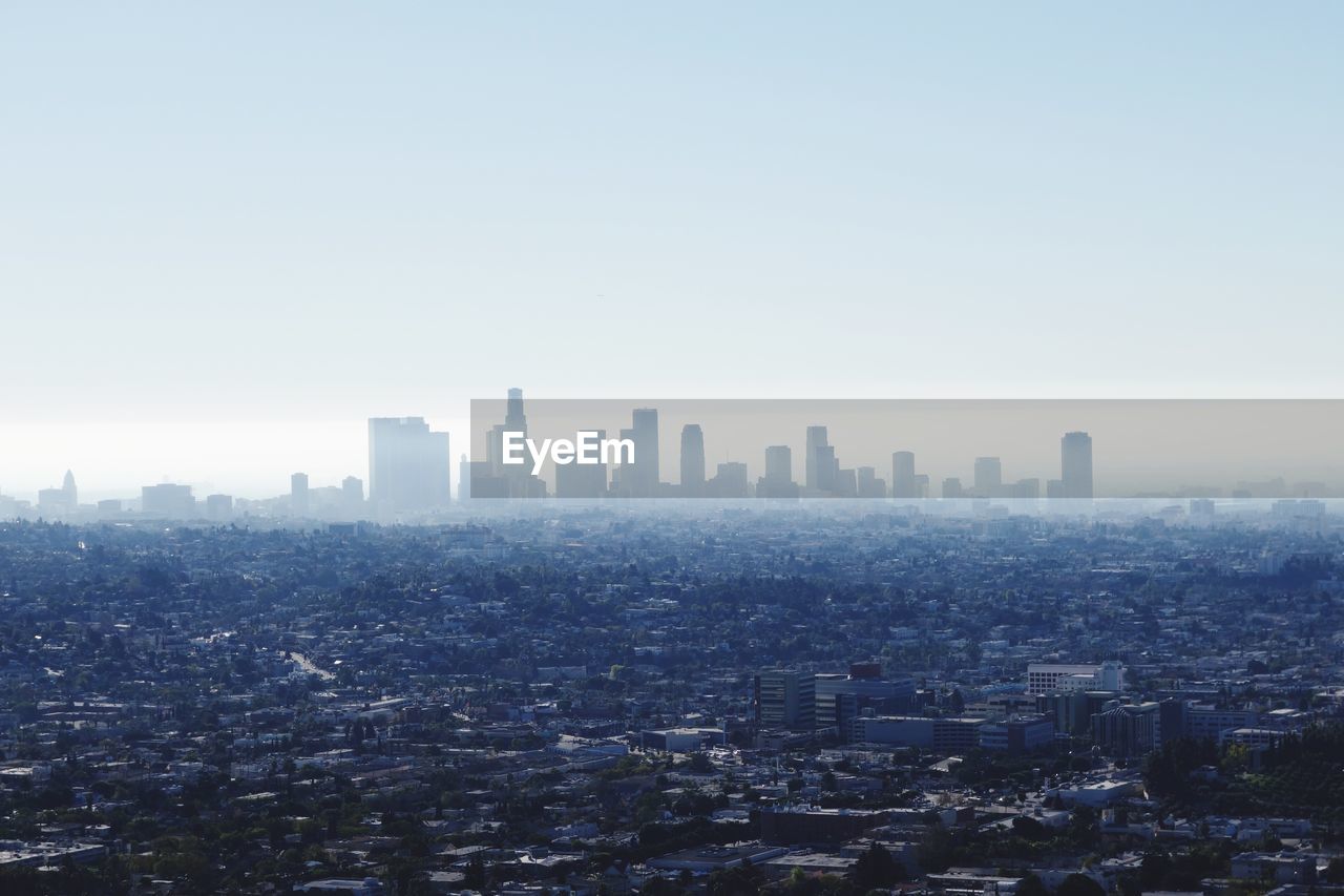 High angle shot of cityscape against clear sky