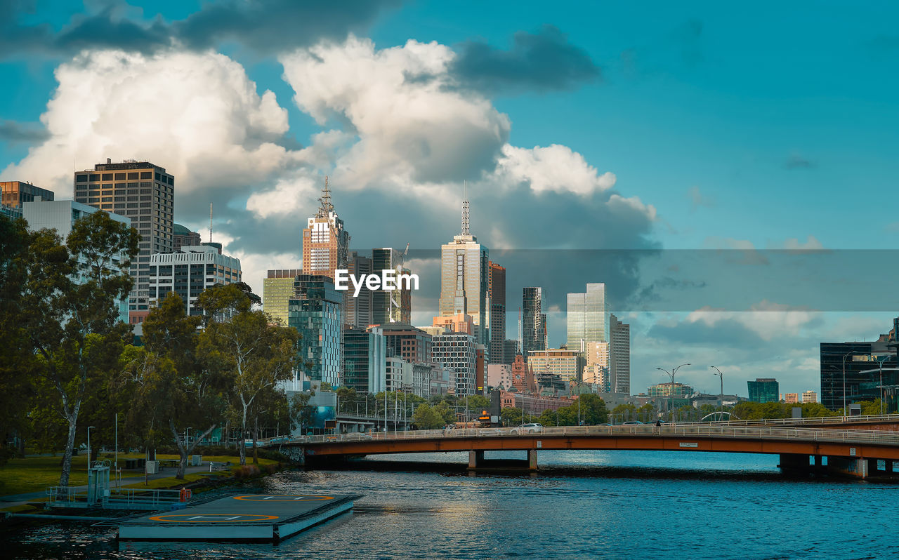 CITY BY RIVER AGAINST SKY