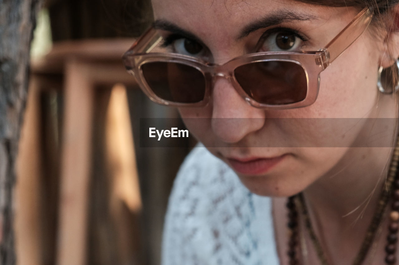 Close-up of young woman wearing sunglasses