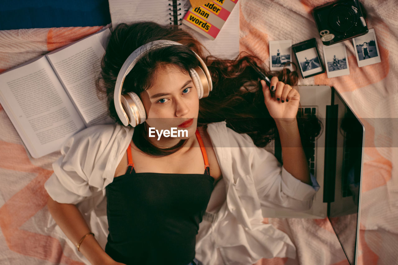 Portrait of young woman relaxing at home