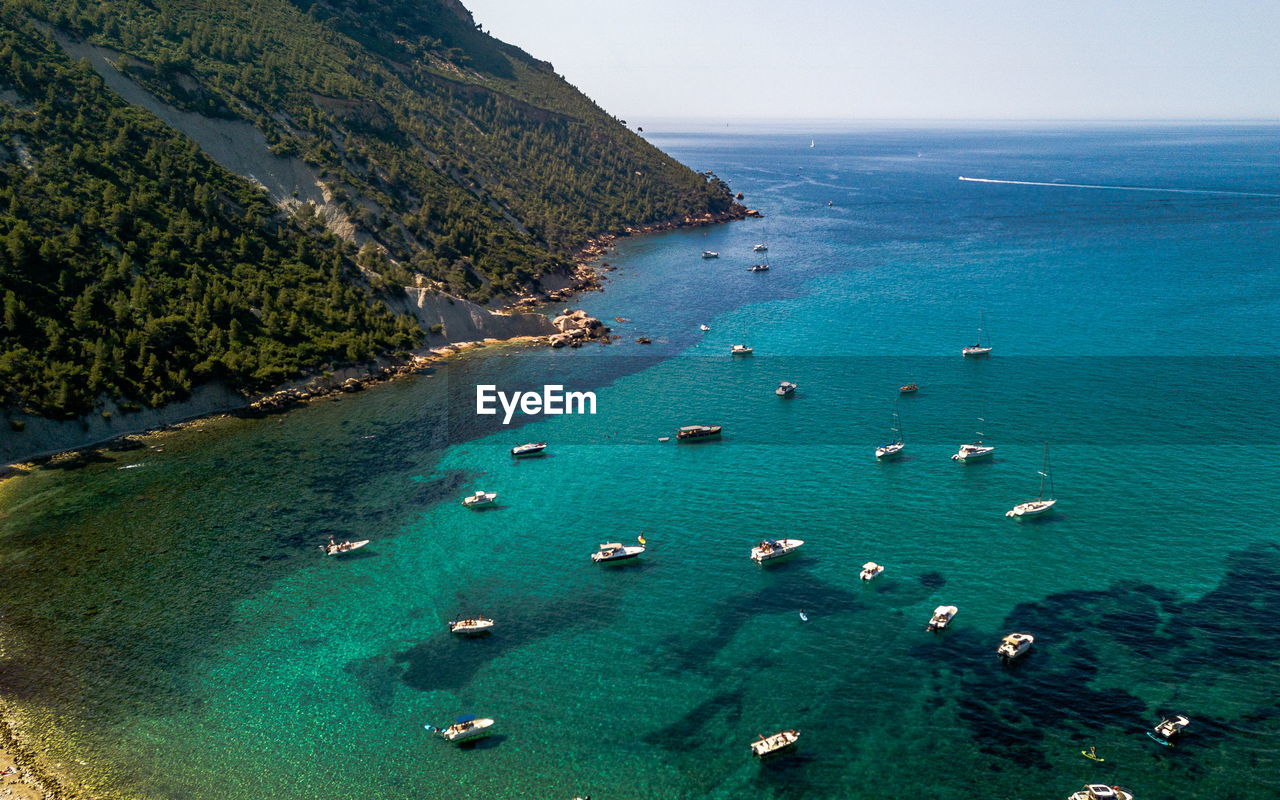 High angle view of boats on sea shore