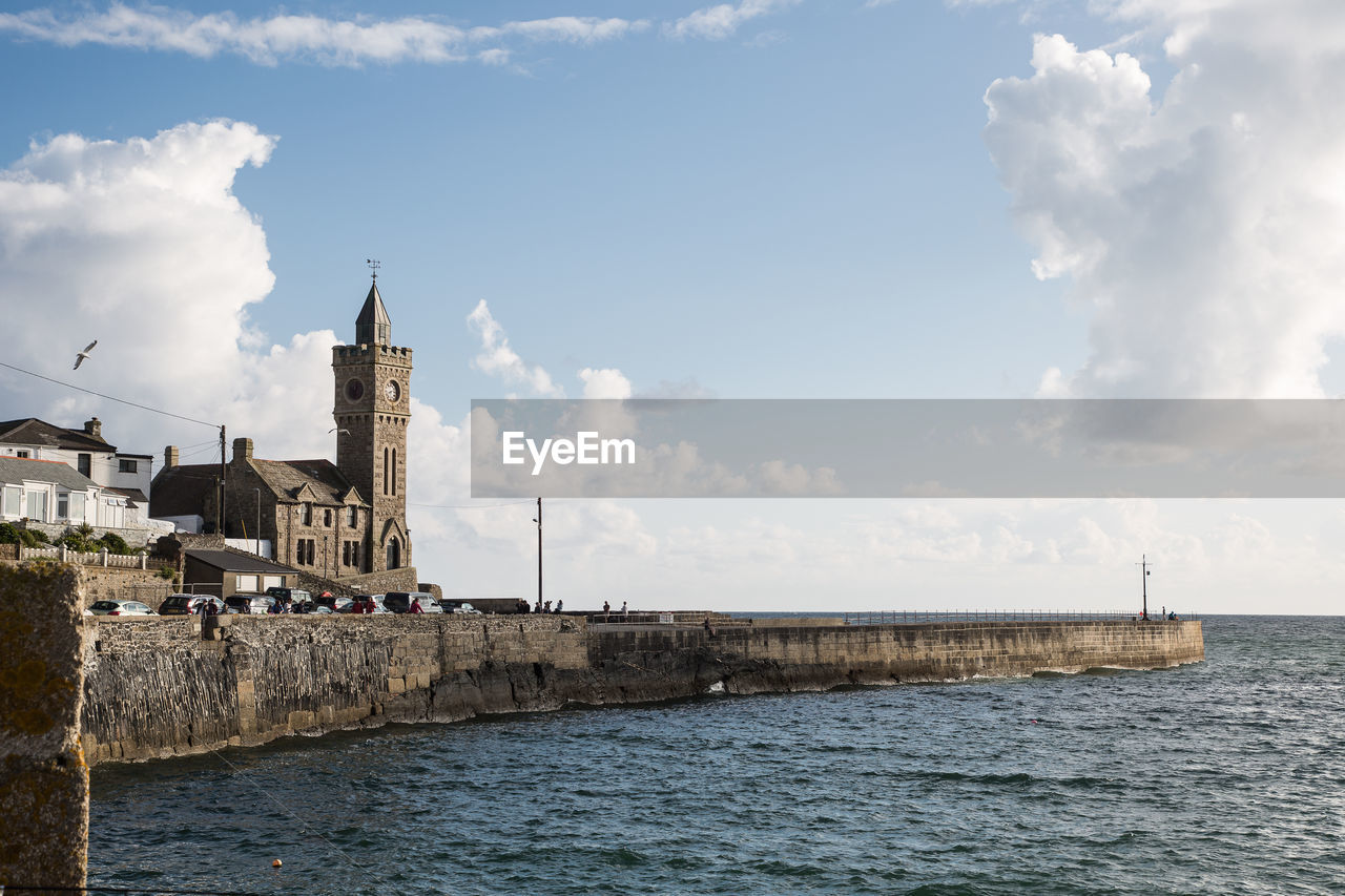 Scenic view of sea and buildings against sky