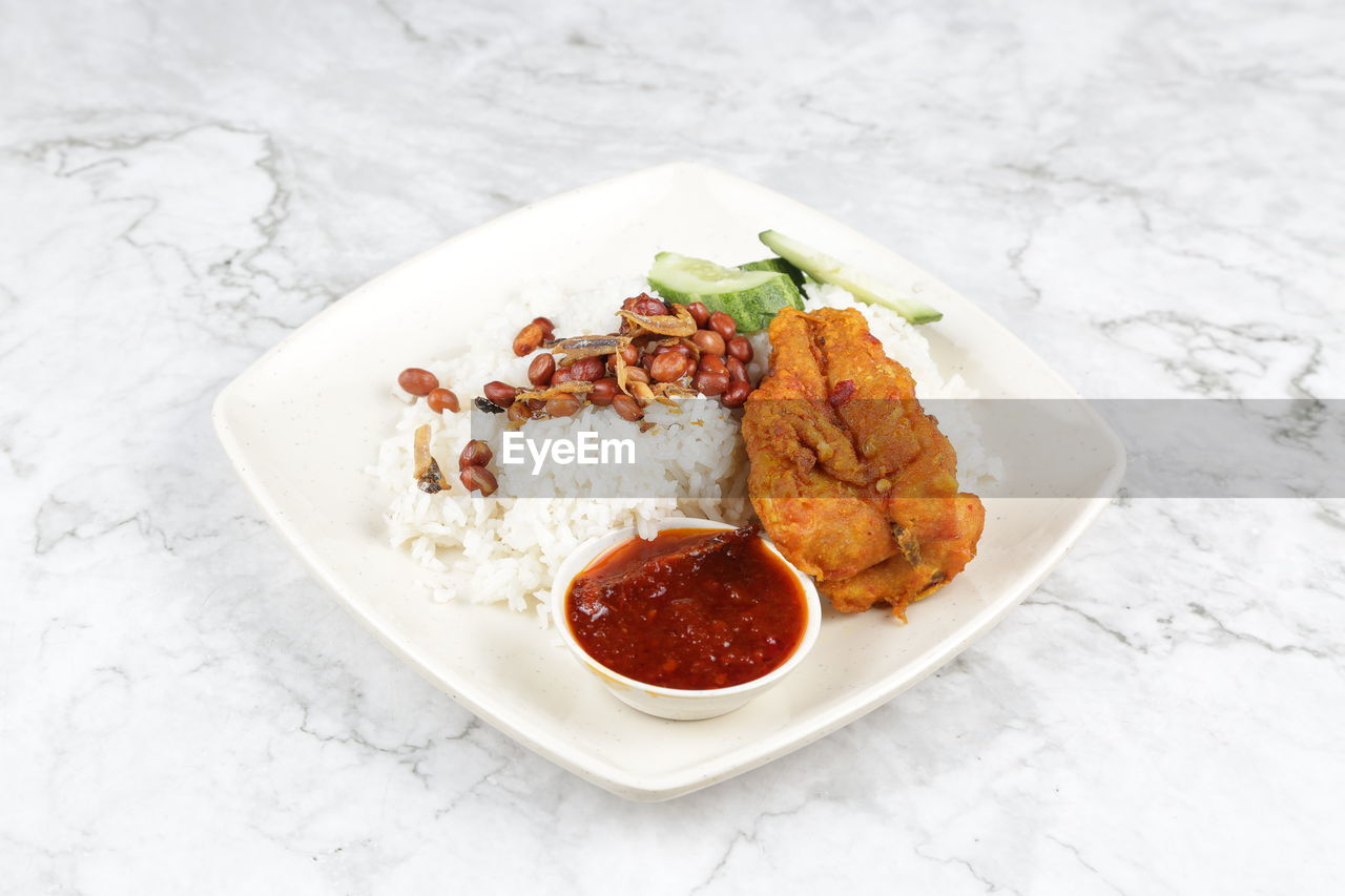 Nasi lemak is a malay fragrant rice dish cooked in coconut milk and pandan leaf. 