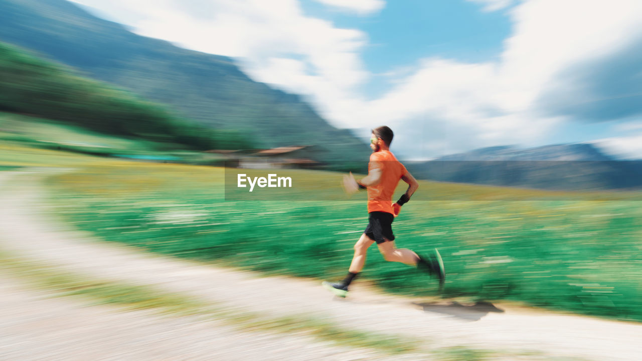 MAN RUNNING ON STREET