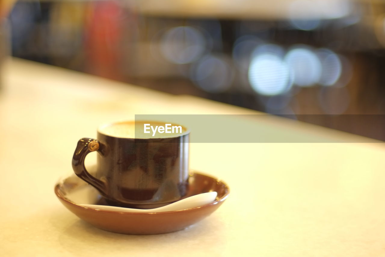 Close-up of coffee cup on table