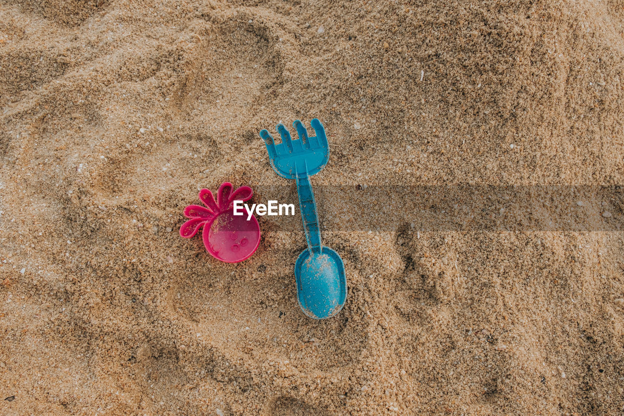 High angle view of toy on sand