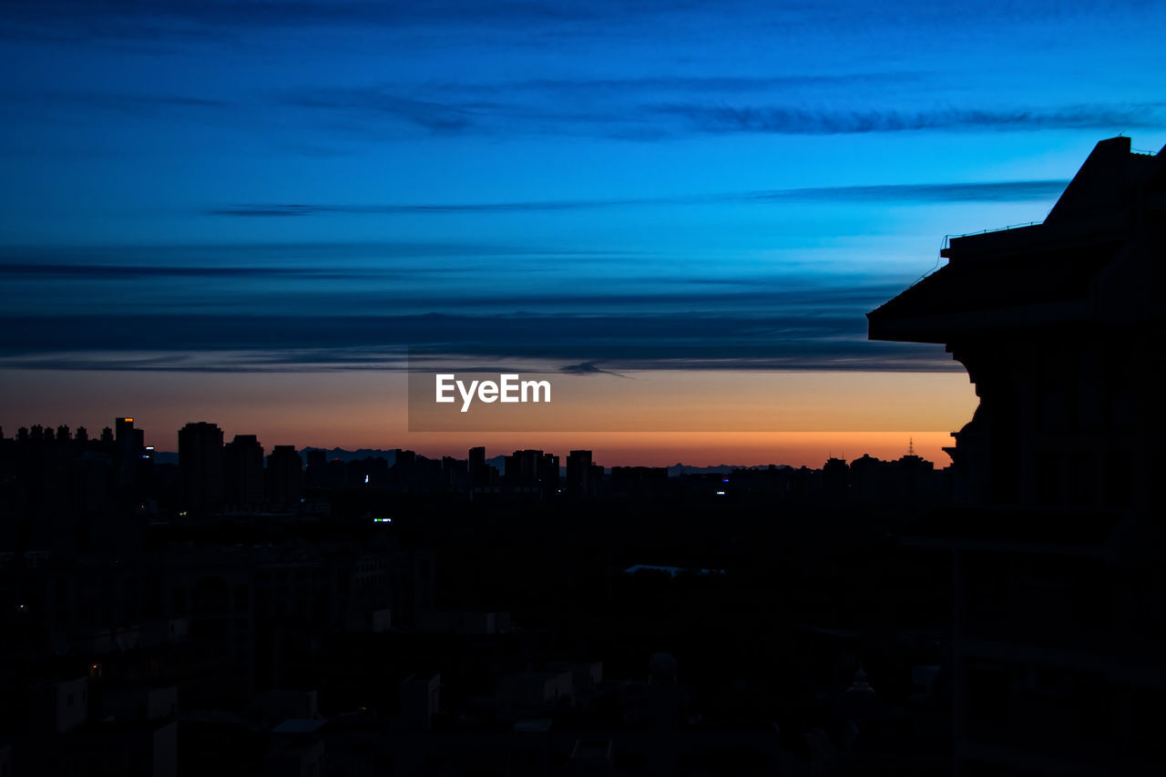 SILHOUETTE CITY AGAINST SKY DURING SUNSET