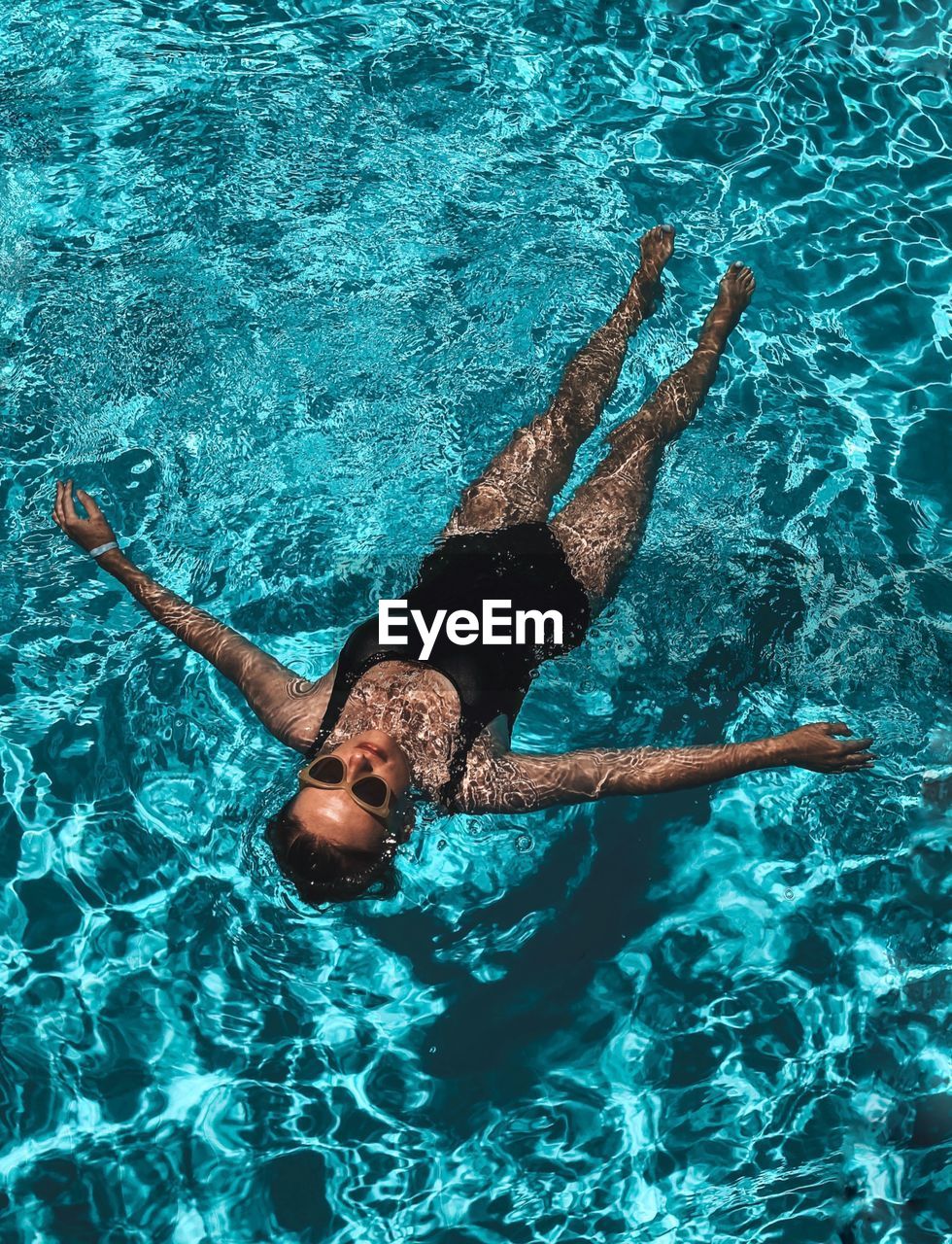 High angle view of person swimming in pool