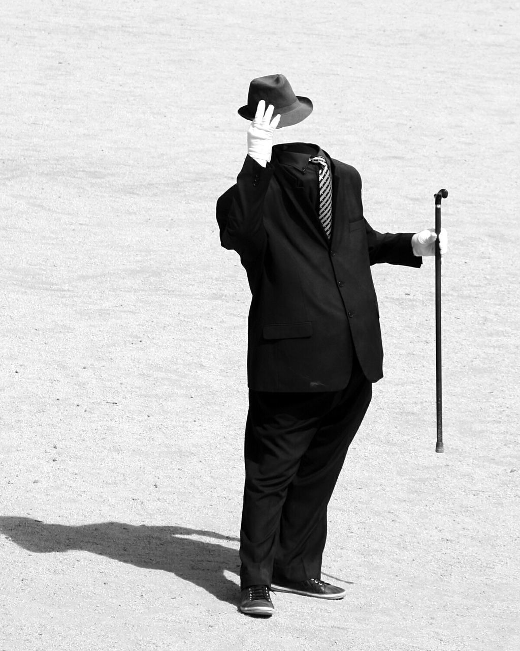 Invisible man lifting hat