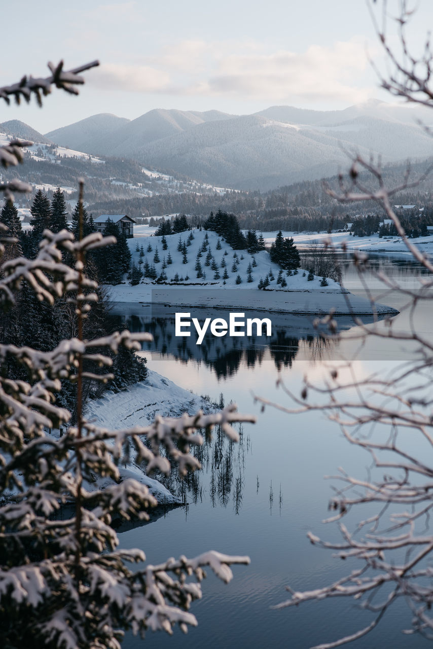 SCENIC VIEW OF RIVER AGAINST SKY DURING WINTER