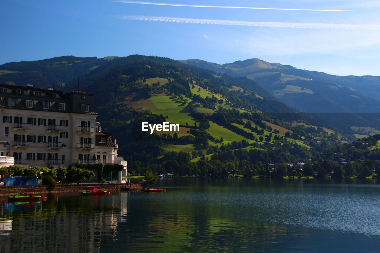 SCENIC VIEW OF LAKE AGAINST MOUNTAIN