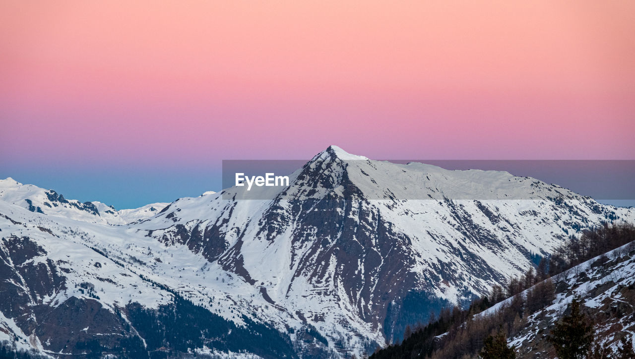 snow, winter, cold temperature, mountain, scenics - nature, beauty in nature, environment, landscape, snowcapped mountain, mountain range, sky, nature, tranquility, tranquil scene, mountain peak, travel destinations, no people, sunset, travel, non-urban scene, summit, ridge, outdoors, idyllic, extreme terrain, land, tourism