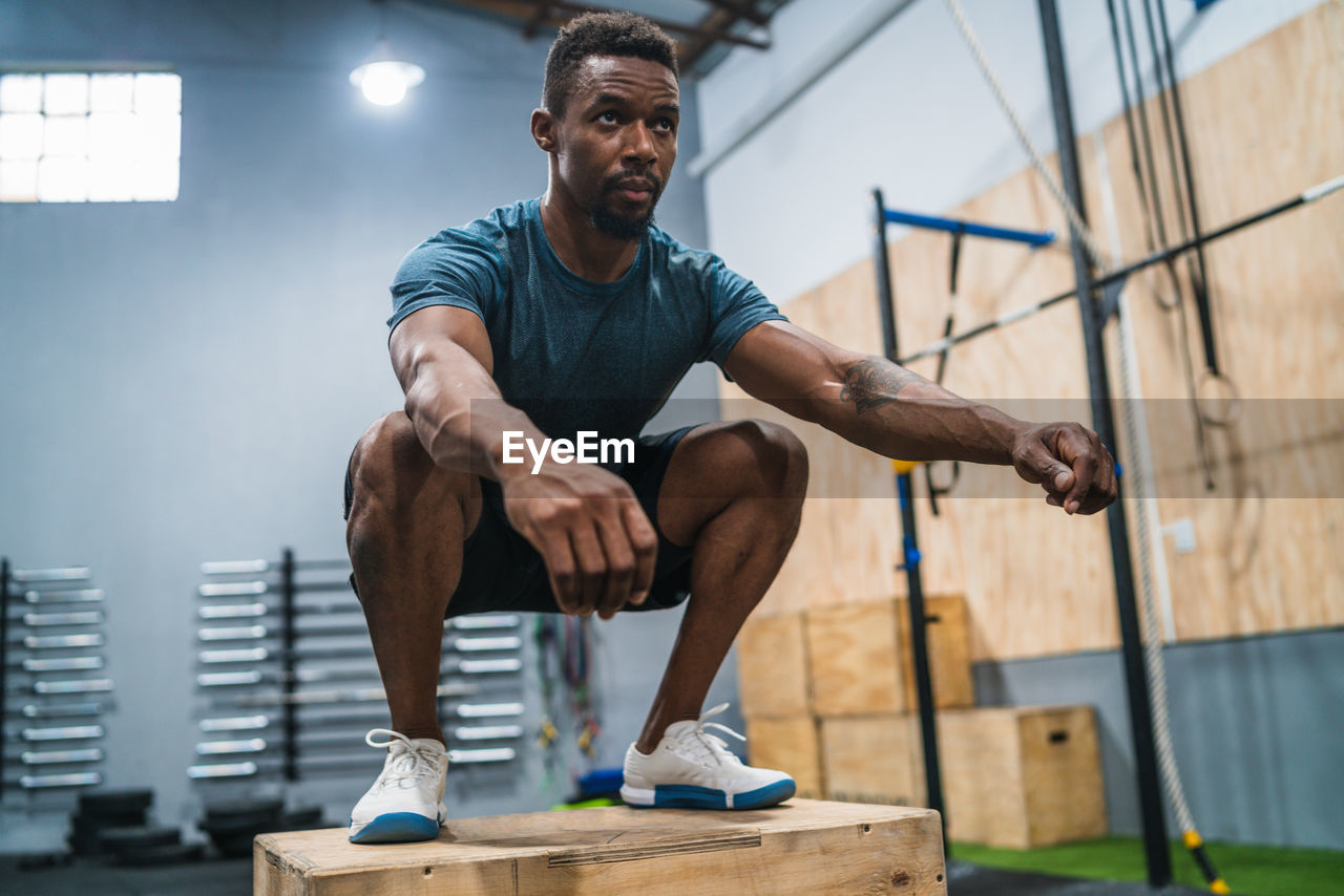 Male athlete exercising in gym