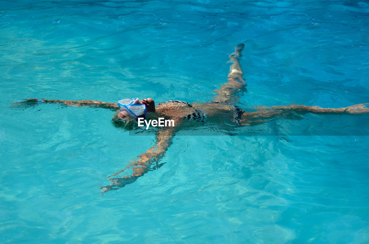 Full length of woman swimming in pool