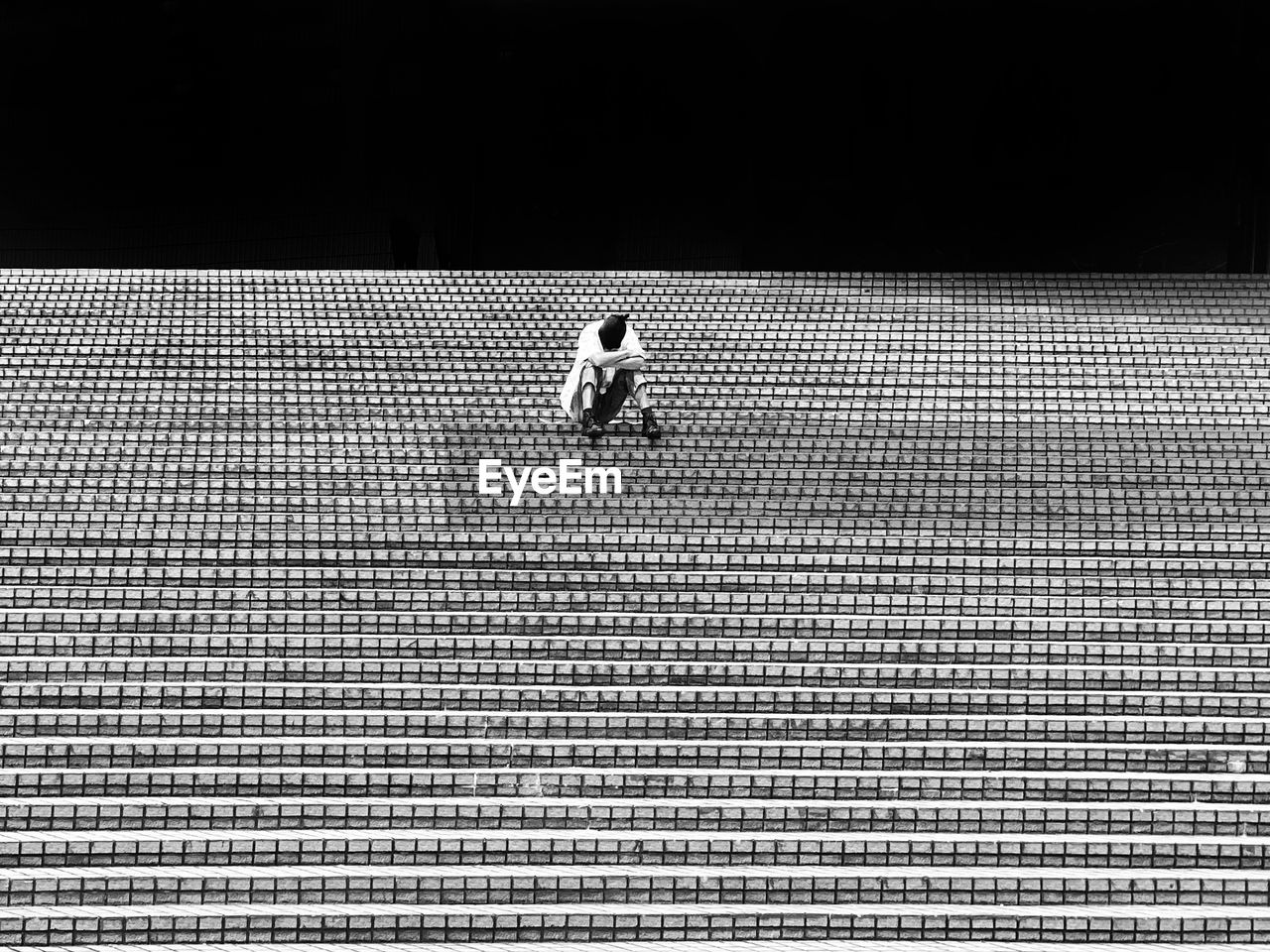 One person napping on steps 