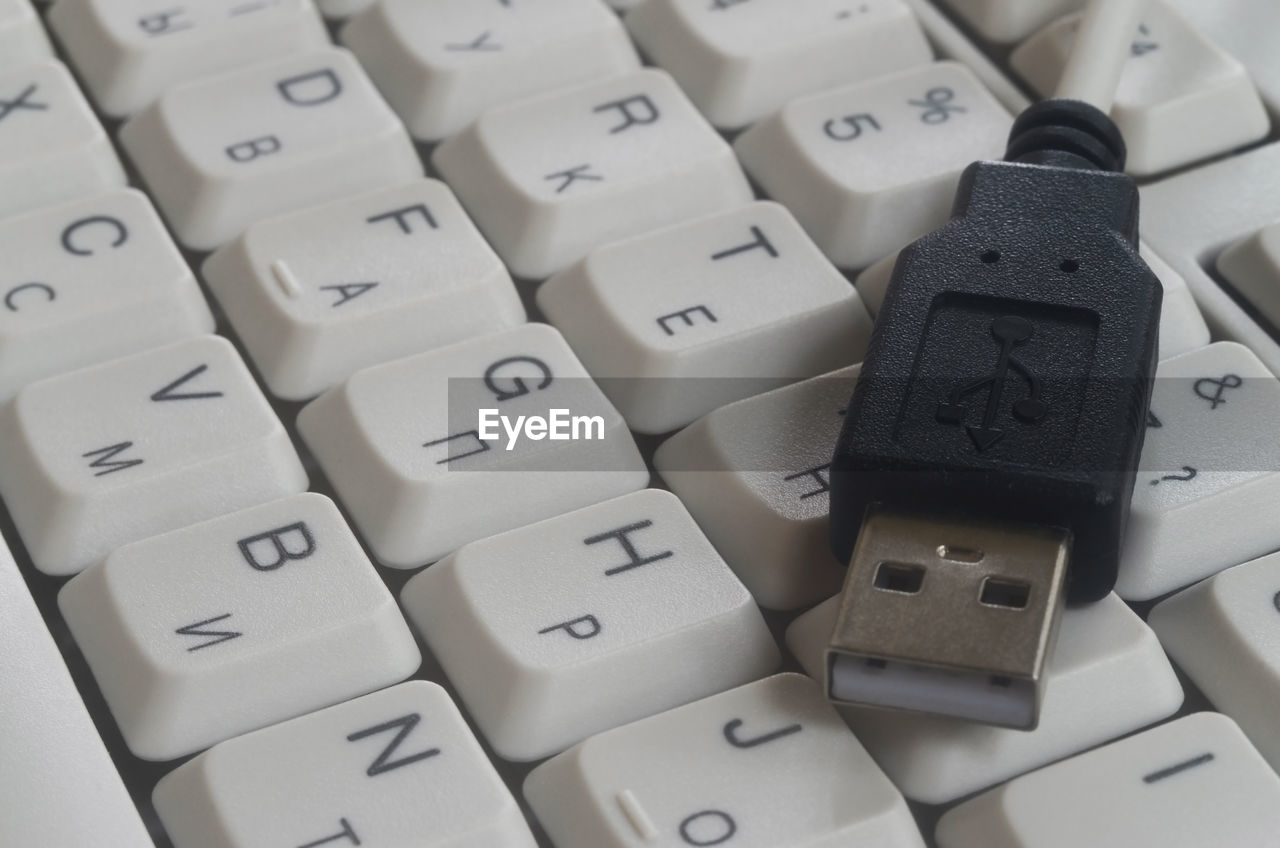 High angle view of usb cable on computer keyboard