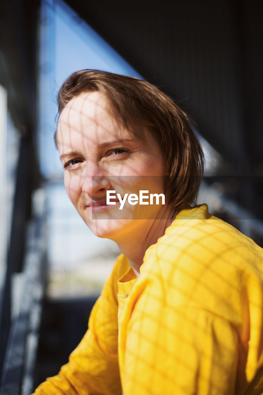 Close-up portrait of smiling woman