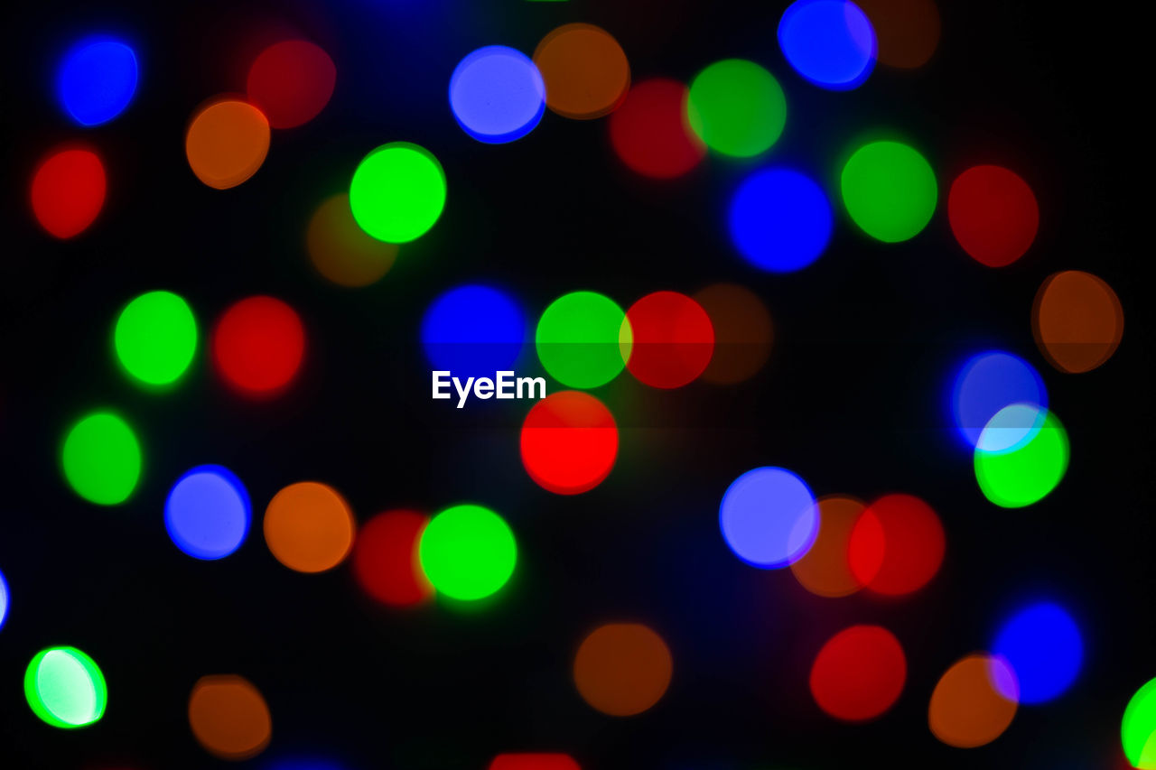 Defocused image of illuminated lights at night