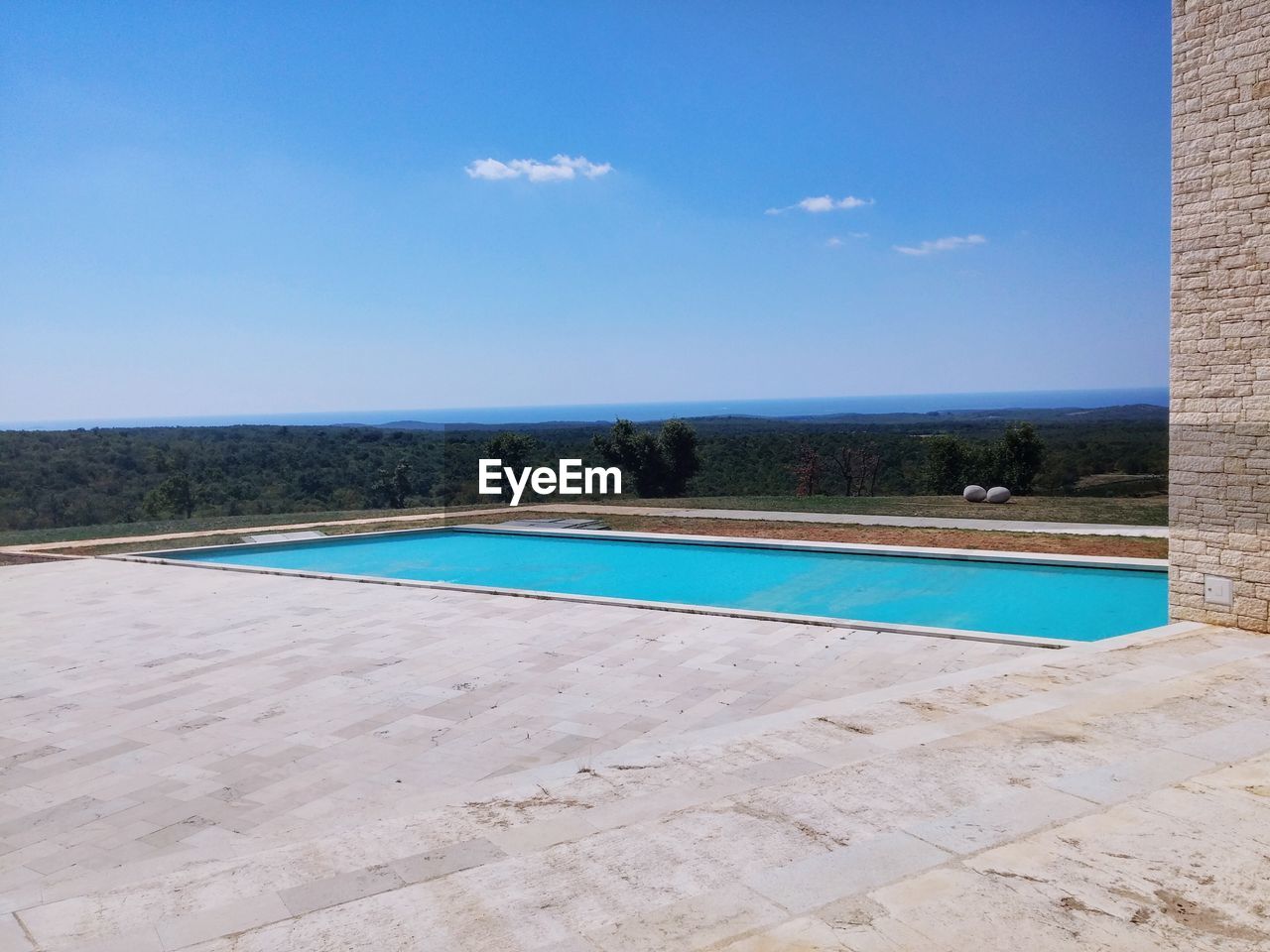 SWIMMING POOL AGAINST SKY