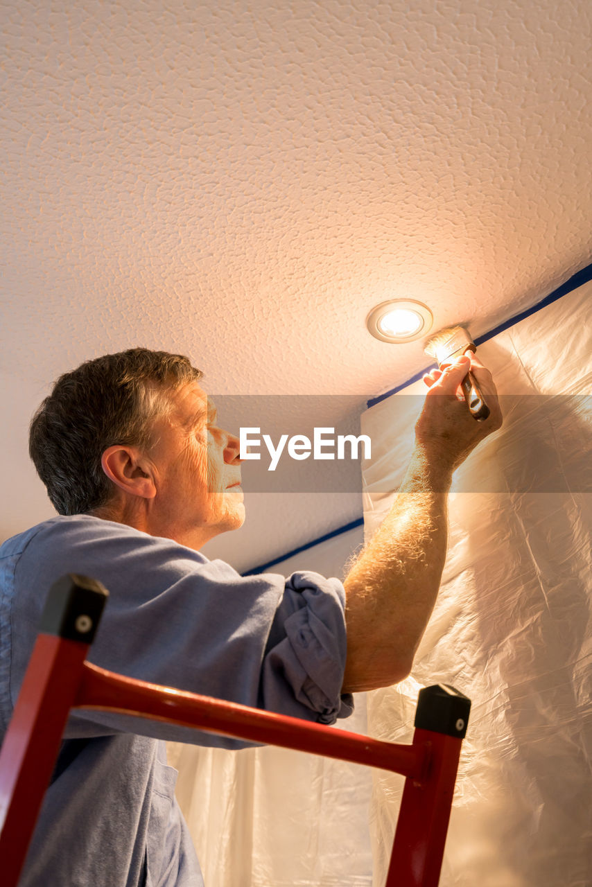 LOW ANGLE VIEW OF A MAN IN A ROOM