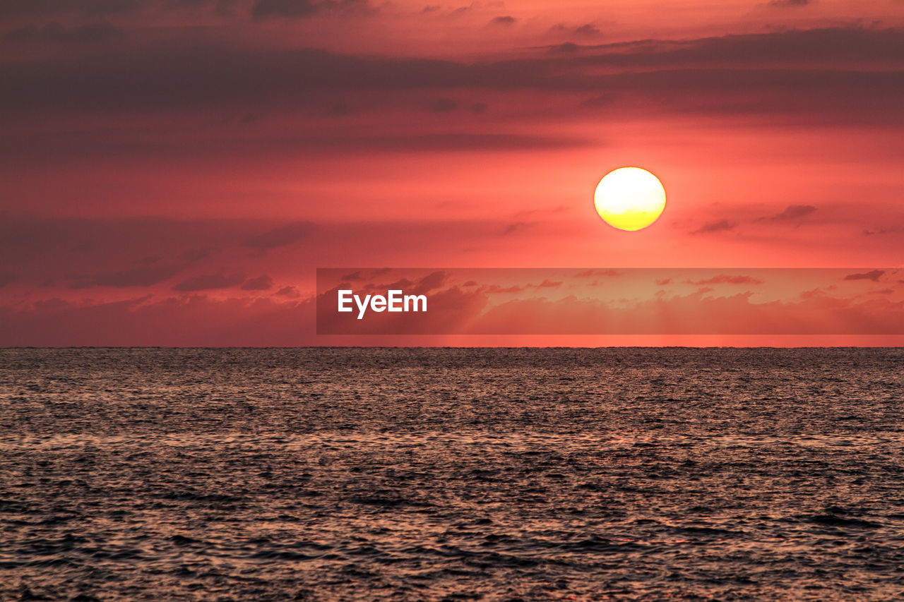 Seascape against sky during sunset