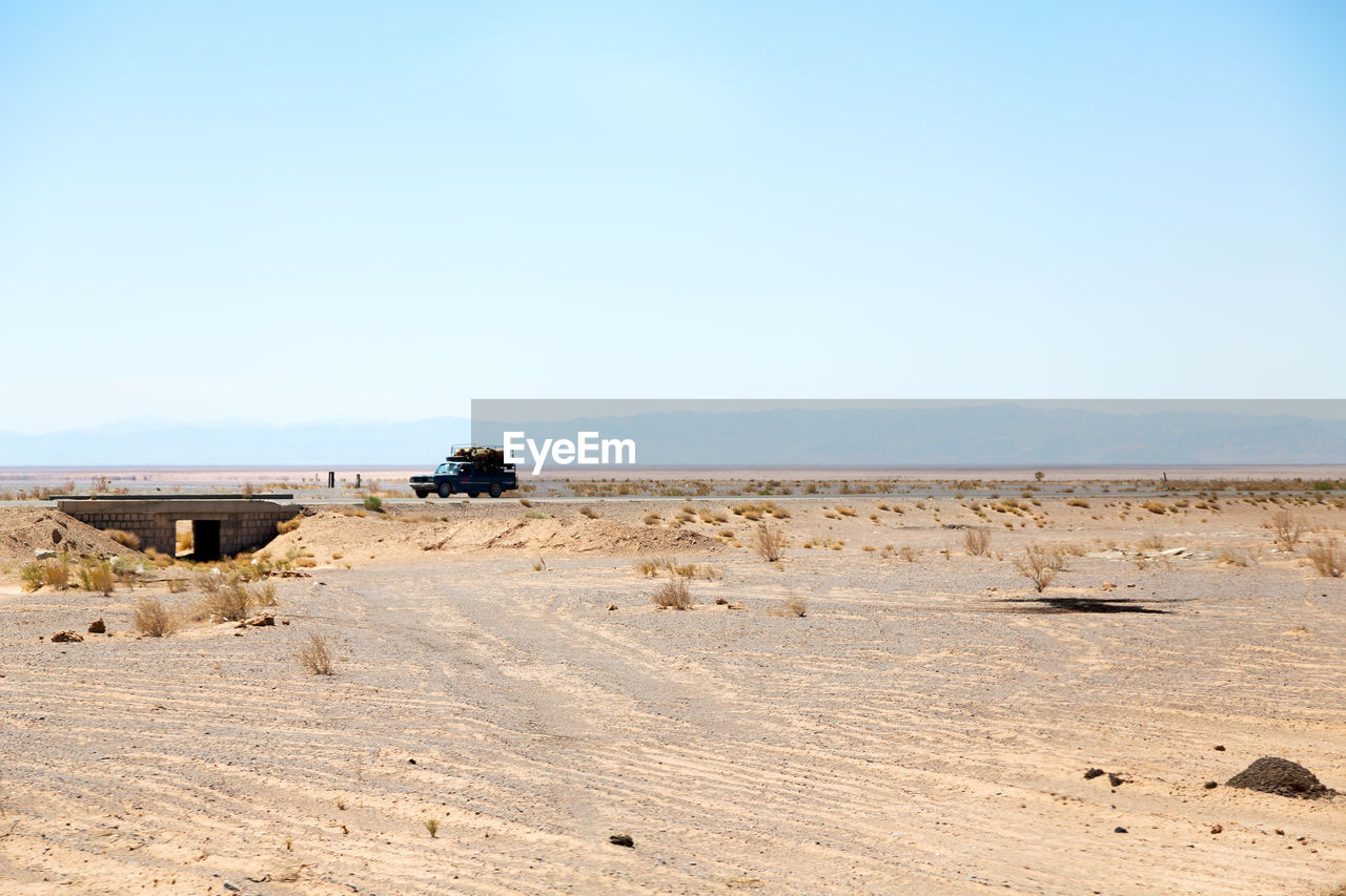 SCENIC VIEW OF DESERT AGAINST SKY