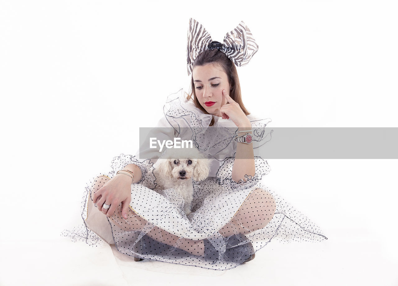 Portrait of pretty girl dressed funny clothes and her little dog