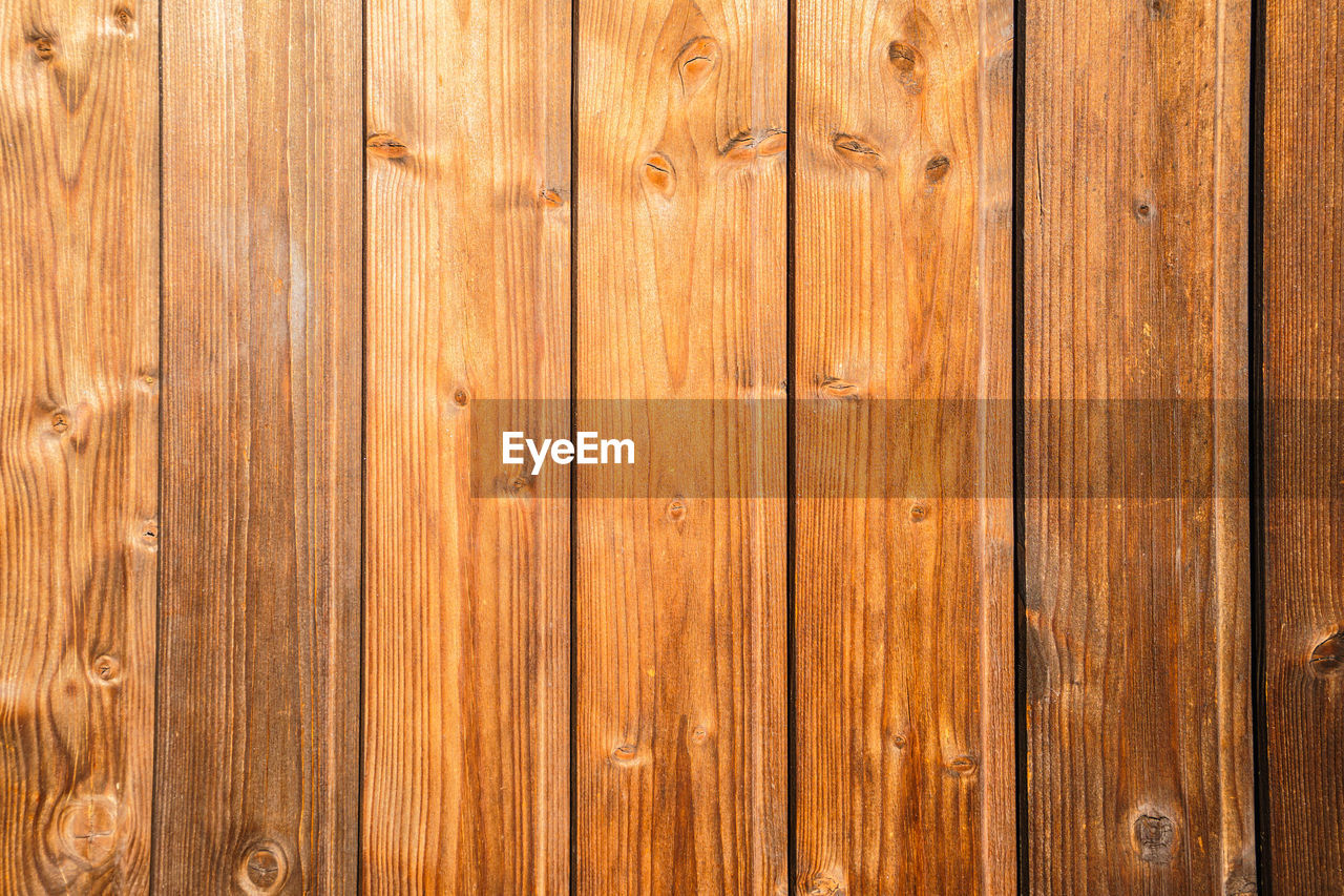 wood, backgrounds, textured, pattern, wood grain, full frame, flooring, brown, plank, hardwood, no people, timber, material, striped, wood paneling, wall - building feature, old, floor, copy space, close-up, in a row, knotted wood, abstract, fence, surface level, rough, architecture, textured effect, hardwood floor, wood flooring, built structure, tree, wood stain, nature, surrounding wall, outdoors, design element, laminate flooring, weathered, floorboard, rustic, macro, construction industry