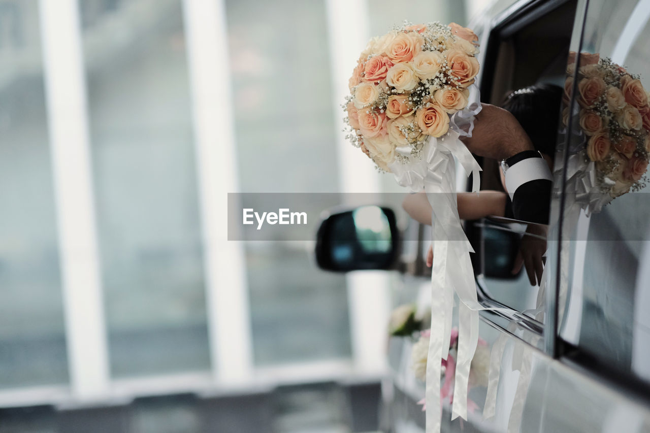 bride, adult, women, ceremony, wedding dress, flower, one person, wedding, spring, day, lifestyles, young adult, outdoors, transportation, female, selective focus, mode of transportation, window, vehicle, business, nature, holding, emotion