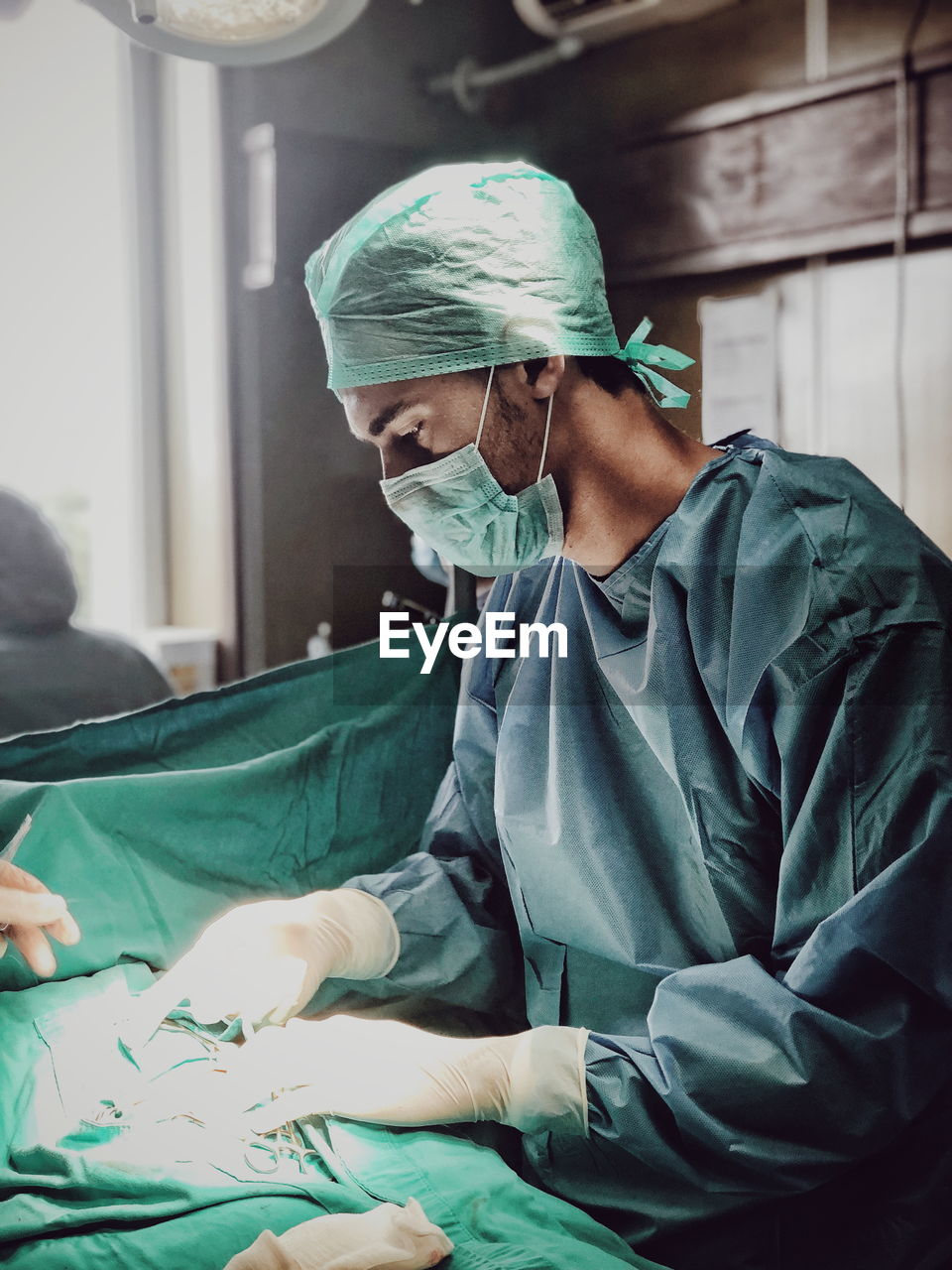 Surgeon picking tools at operating room