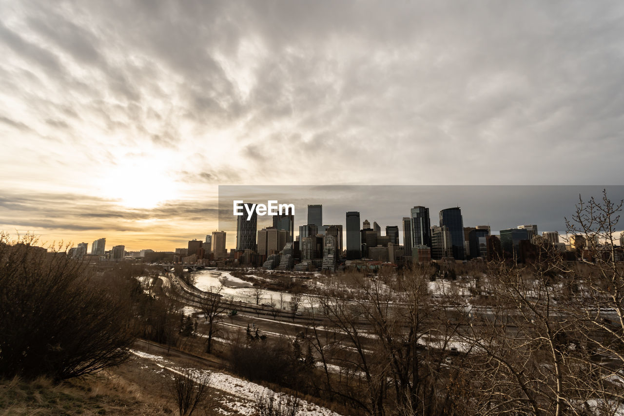 Cityscape against sky during sunset