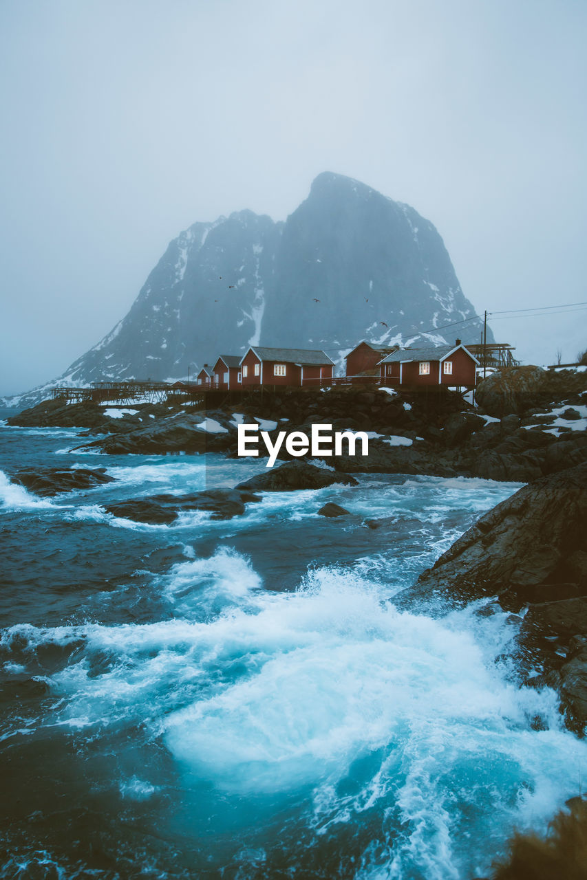 Scenic view of sea against sky during winter
