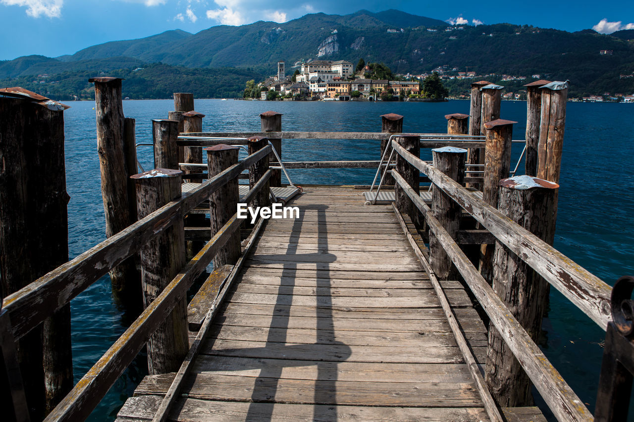 View of jetty leading to sea